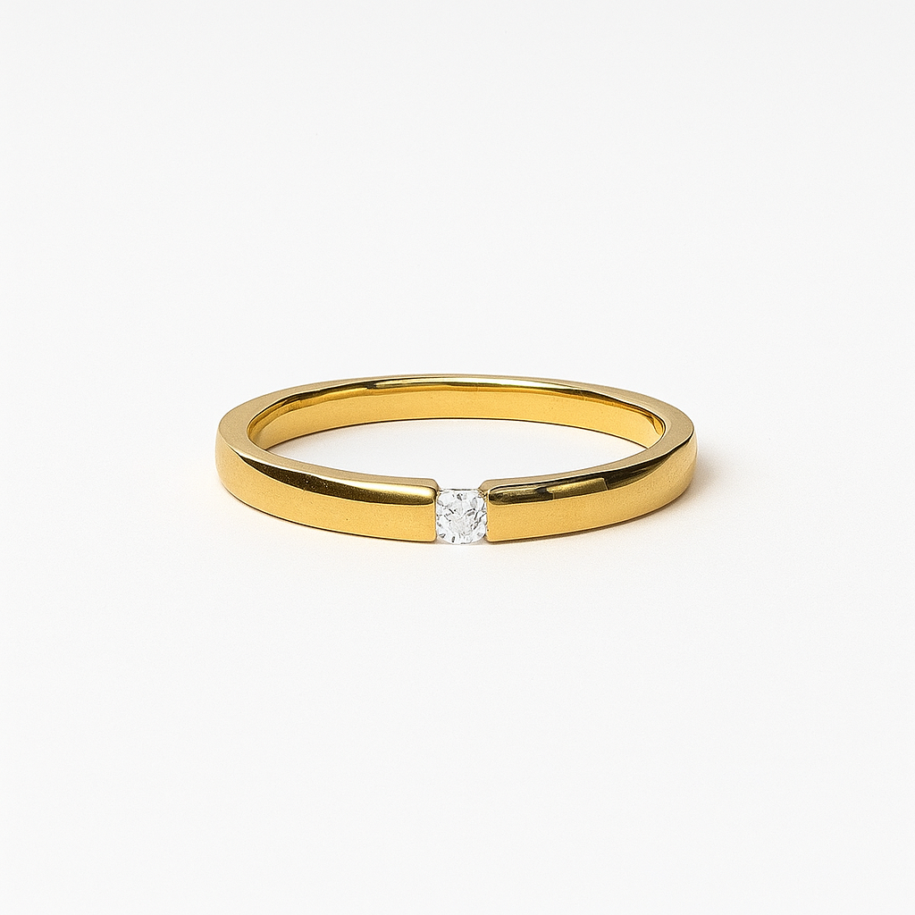Gold ring with a diamond on a white background