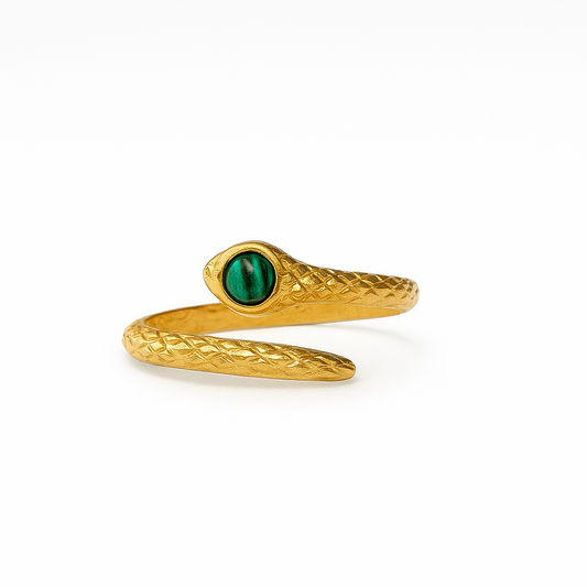 Gold snake-shaped ring with a green stone on a white background