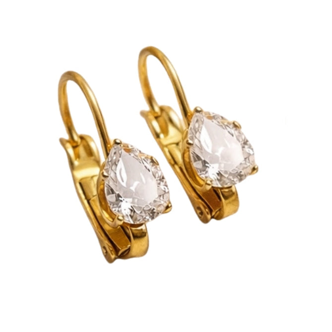 Gold hoop earrings with clear gemstones on a white background